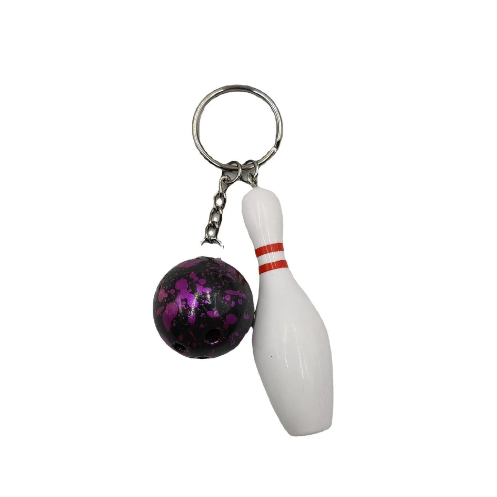 Mini PVC metal bowling ball keychain pendant in blue, dark red, green, or purple.