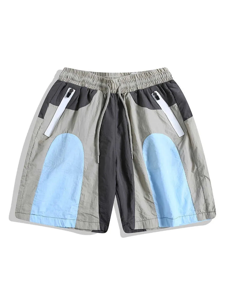 Blue patchwork quick-drying shorts with loose straight-leg styling and micro-elastic waistband
