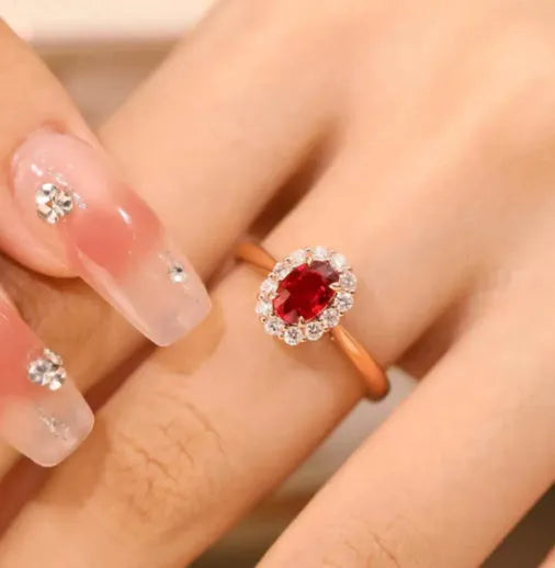Gold Pigeon red blood gemstone silver-plated ring with floral design on white background