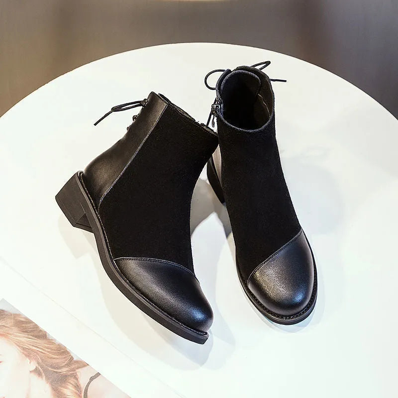 Black women's Martin boots with side zip, round toe, and short stout heel