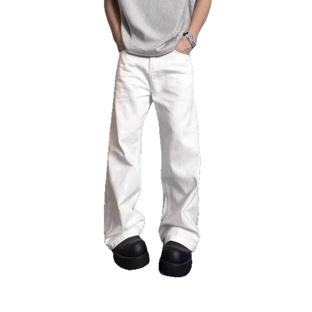 Men's loose fit straight leg white denim jeans on a hanger, showing wide leg opening and zipper fly.
