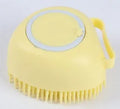 Silicone dog bath brush in blue, pink, and yellow colours, compact 9x6x8.5cm grooming tool