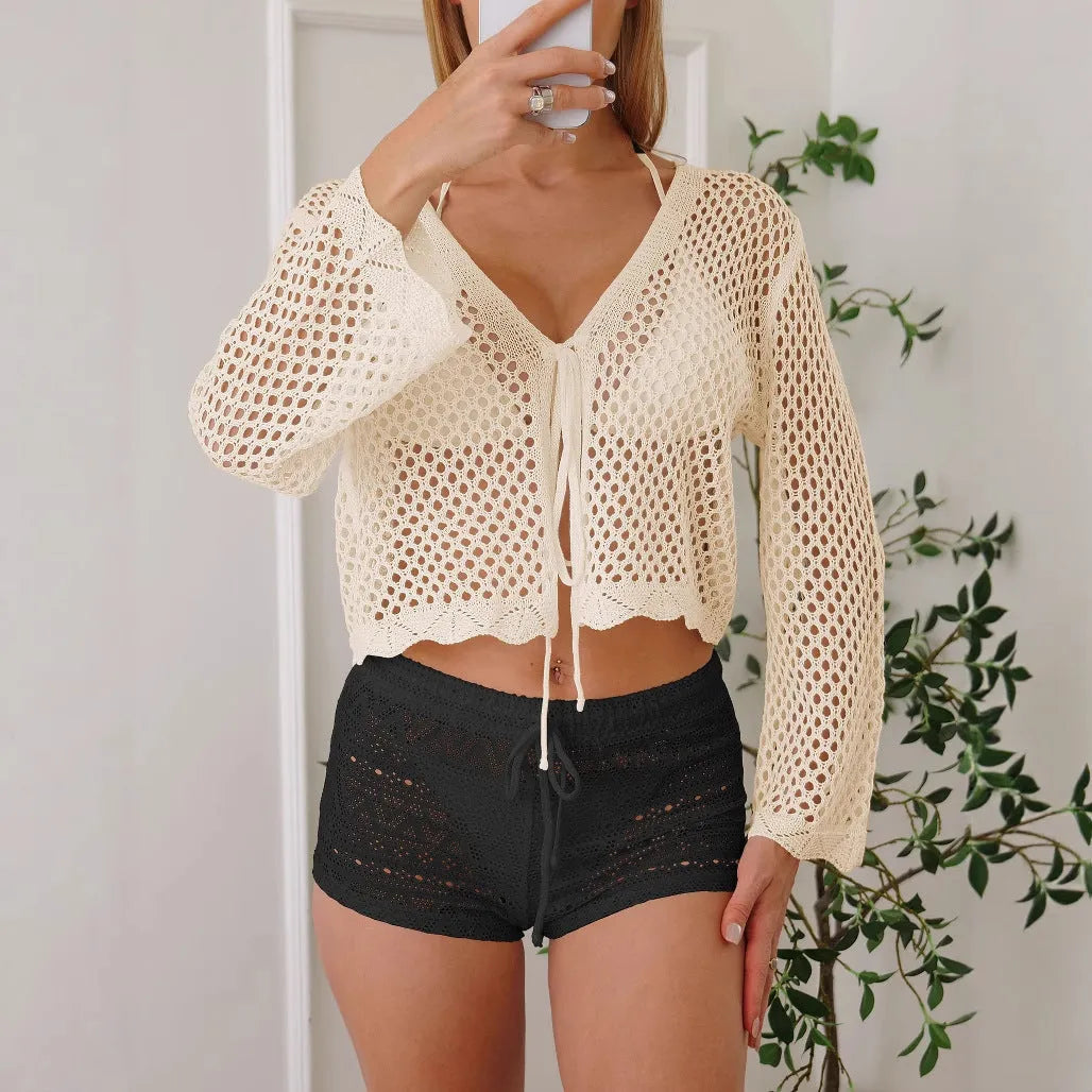Women's apricot hollow woven cardigan blouse with bell sleeves, shown as a short-length layering piece.