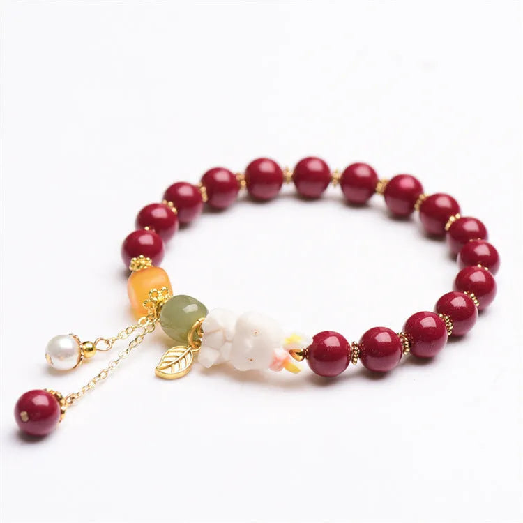 Natural cinnabar rabbit charm bracelet in Chinese national style, available in 8mm or 10mm diameters