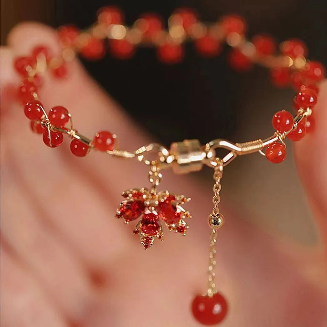 Red ginkgo leaf magnetic bracelet in alloy with electroplated finish on white background