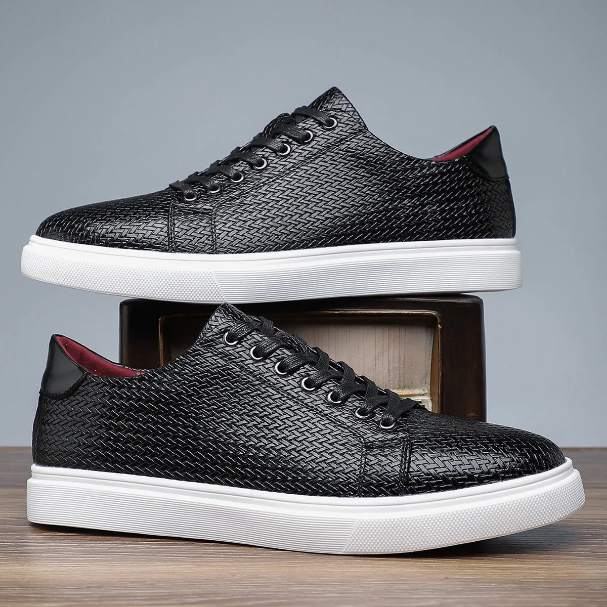 Men's low-top business shoe with artificial PU upper, rubber sole, and stitching detail in black