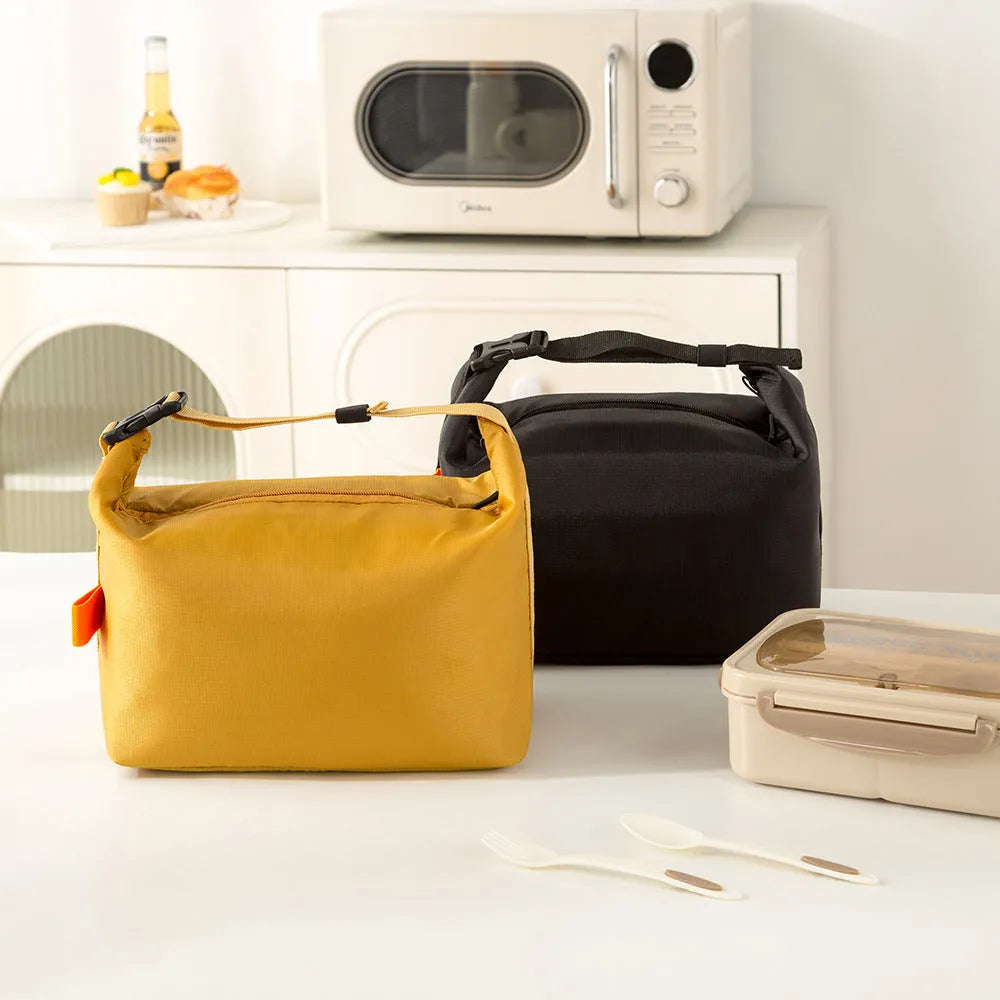 Japanese style insulated lunch bag in Oxford cloth, shown in one of four colours.