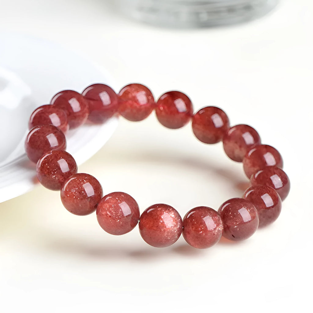 Natural strawberry quartz geometric bead bracelet showing colour and size options for men and women.