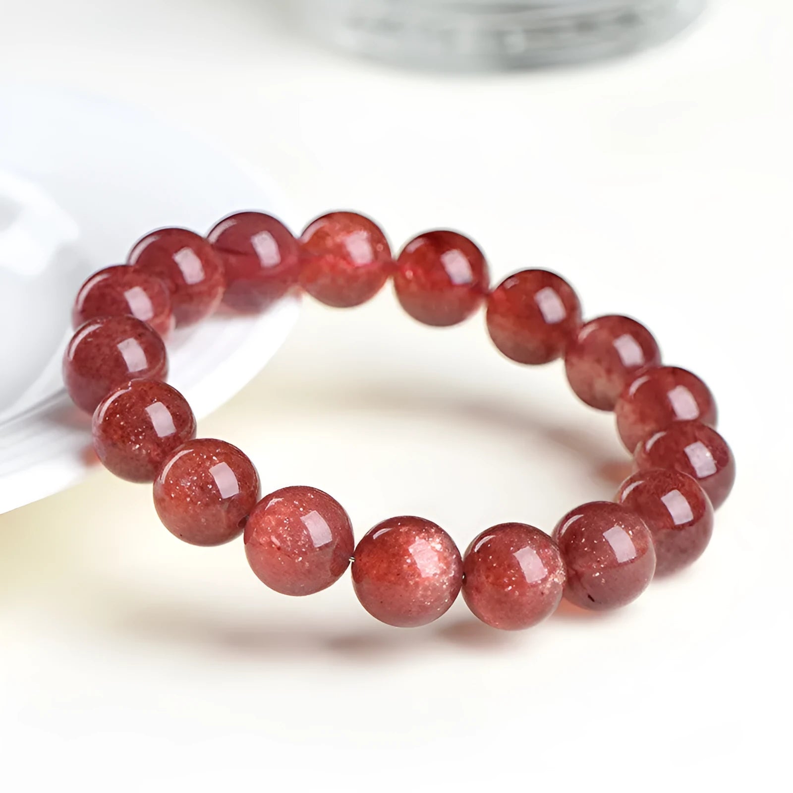 Natural strawberry quartz geometric bead bracelet showing colour and size options for men and women.