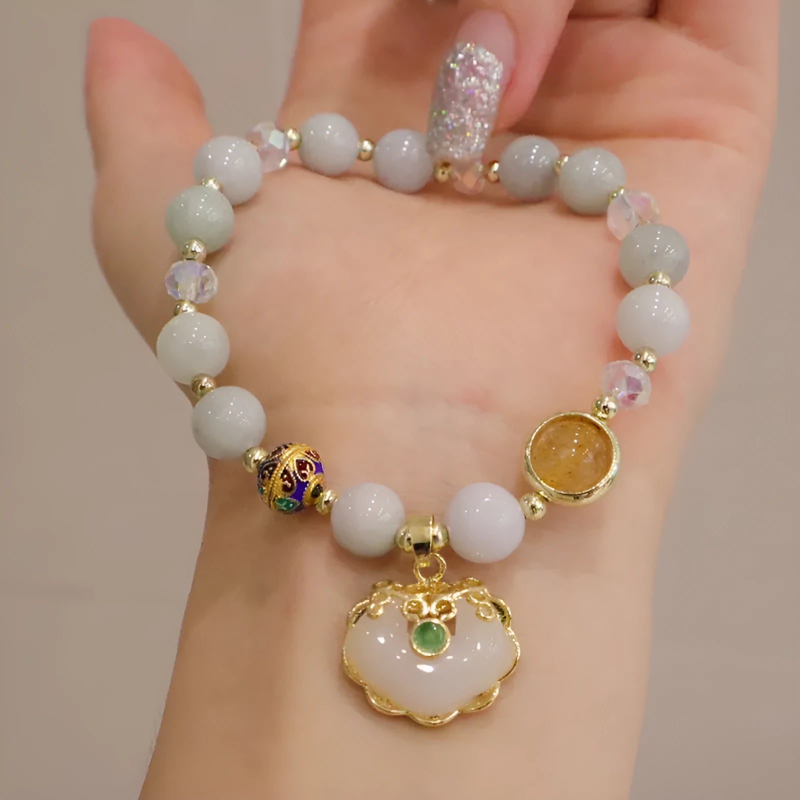 Women's jade geometric bracelet with metal ethnic decoration in Gray Jade and Strawberry Quartz