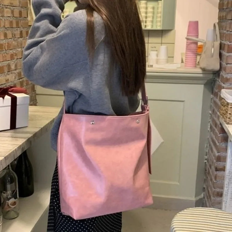 Pink corduroy one-shoulder bag with PU lining showing dimensions 39×32×11cm