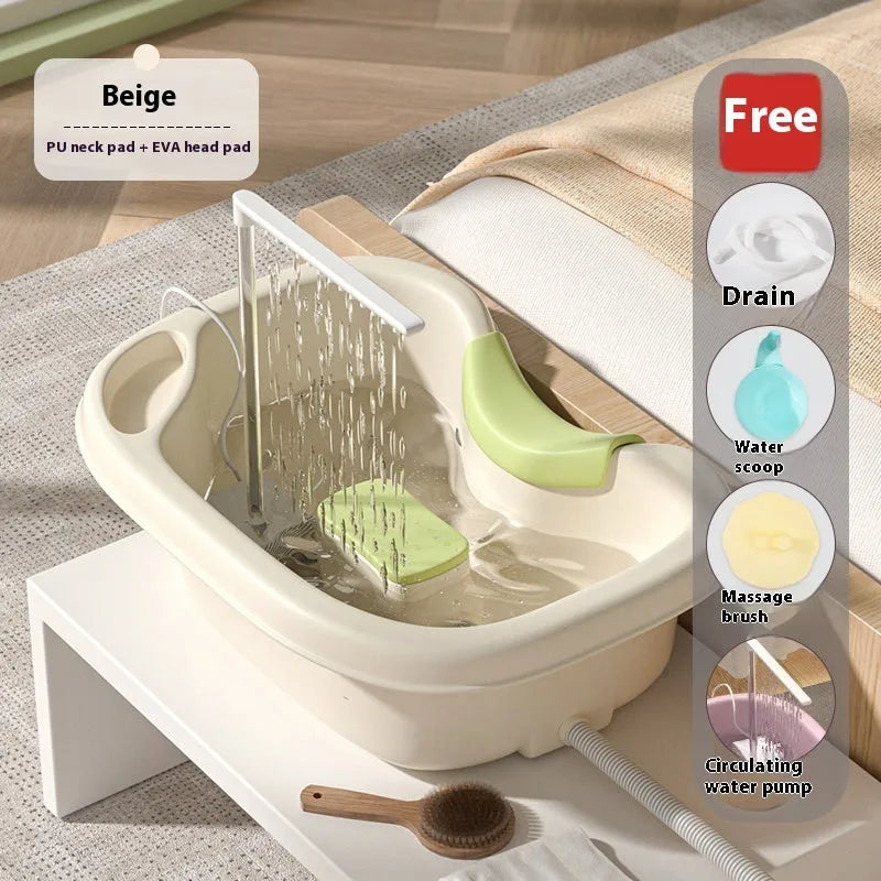 Portable plastic bed shampoo basin set with head pillow, water pump, and accessories in light pink colour.