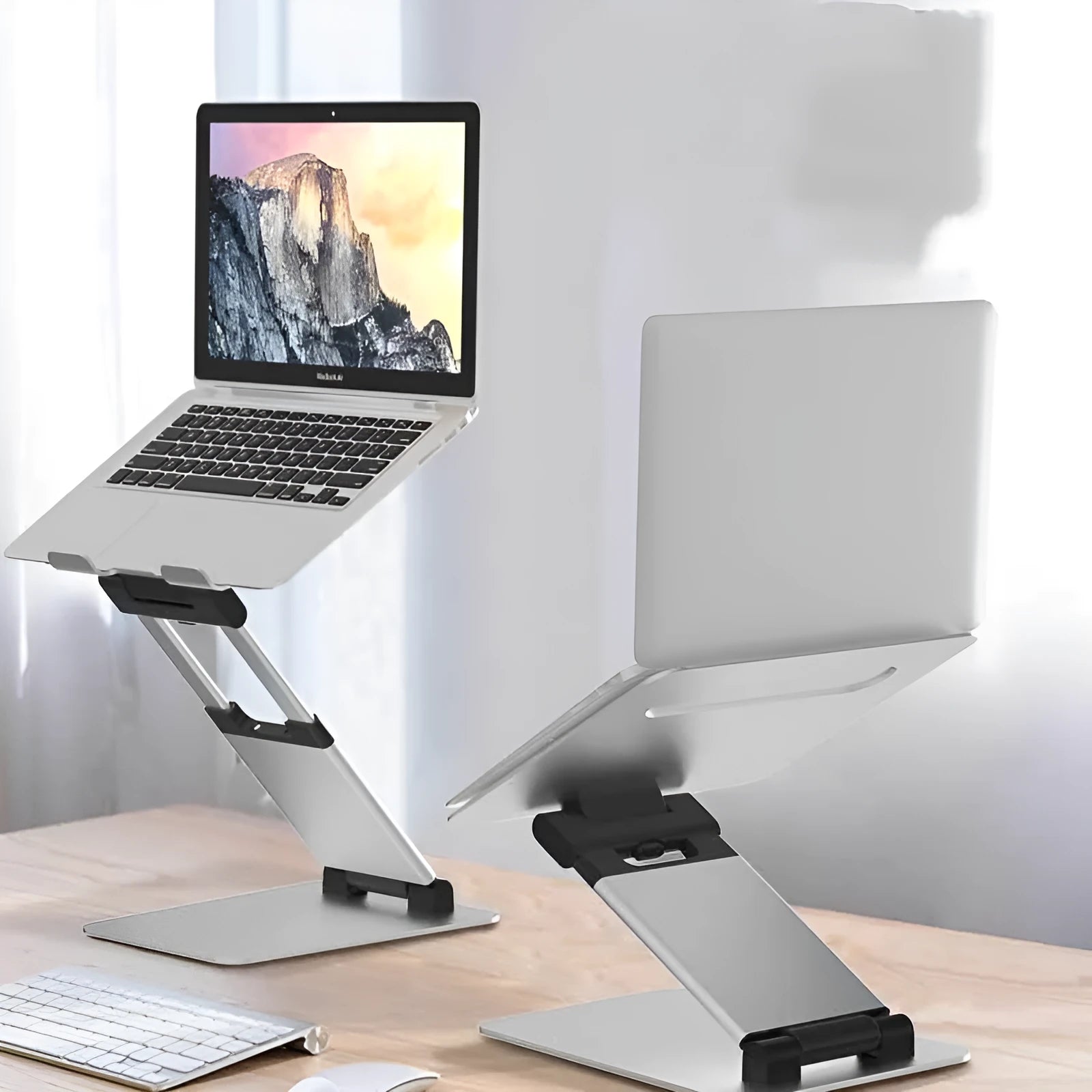 Silver aluminium alloy folding double-arm stepless stand holding a 17-inch notebook on a desk