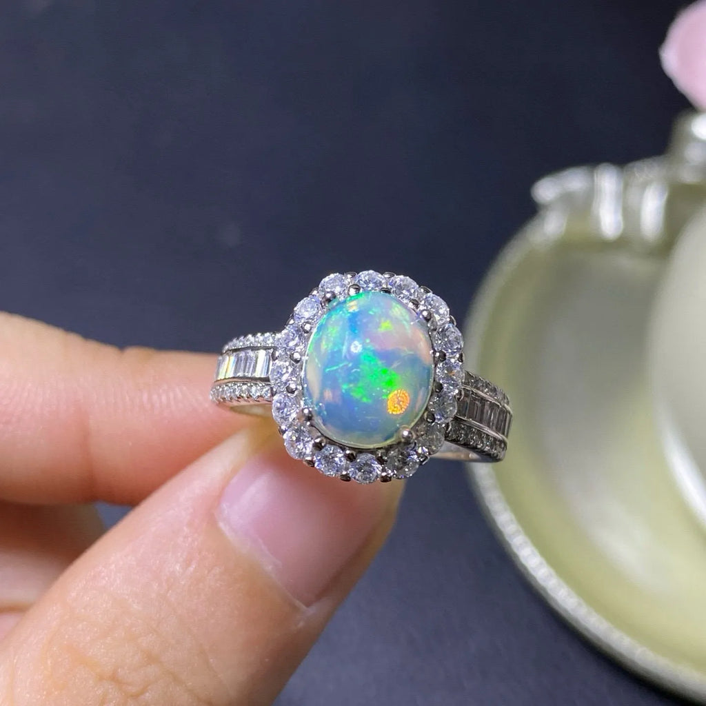 Handmade natural opal silver ring in gold colour with adjustable opening on hand