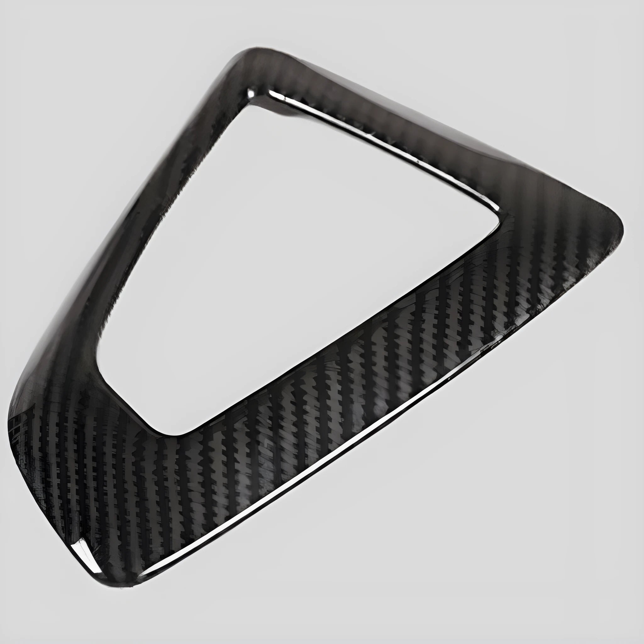 BMW gear base frame in carbon fibre pattern with titanium finish, 13x9cm, left-side fitment