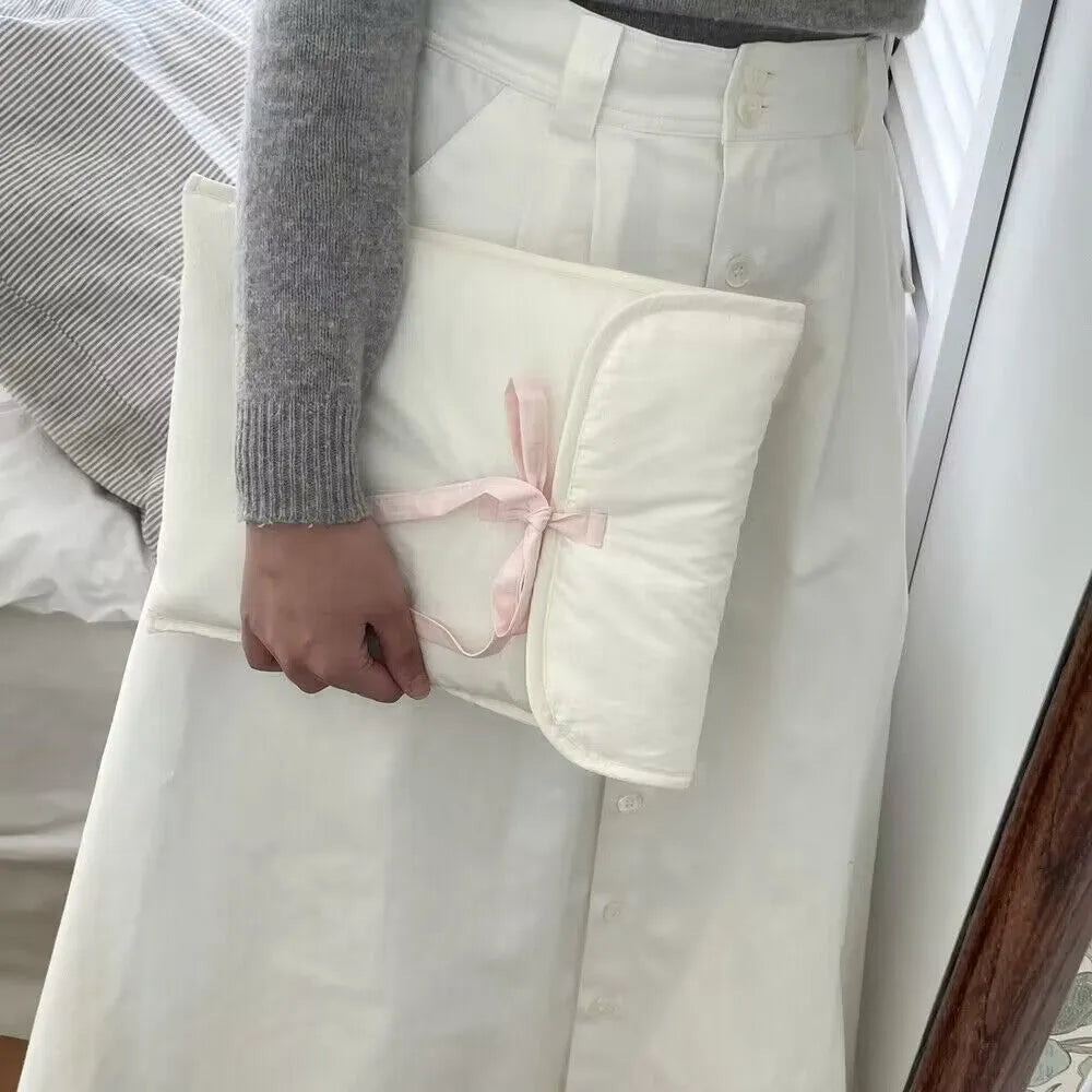 Women's black quilted computer bag with ballet bow and striped pattern