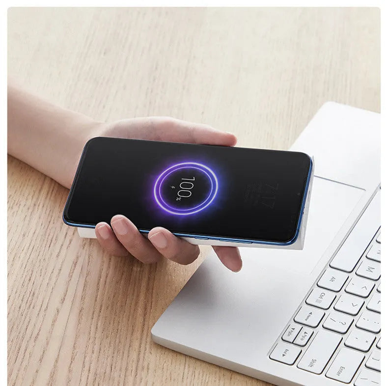 Black and white 10000mAh power bank with USB Type-C port and wireless charging