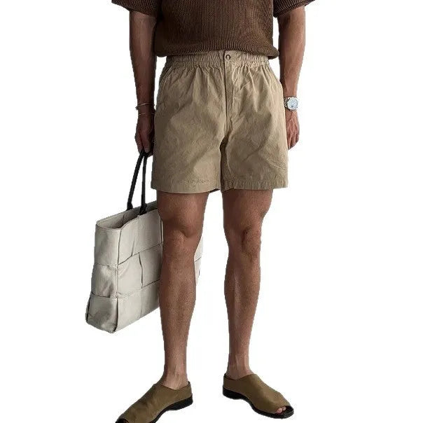 Cotton loose-fitting sports shorts in black, white, and khaki colours for summer wear