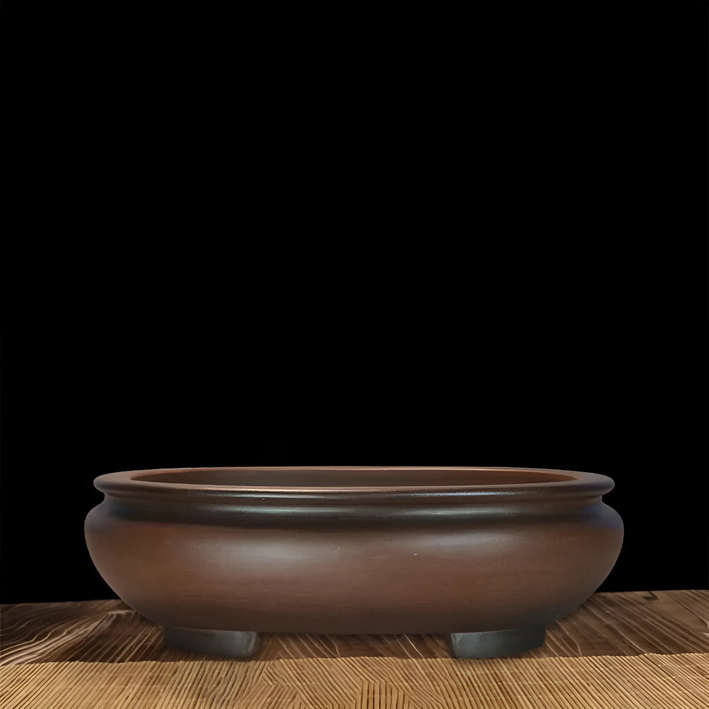 Handmade classical purple clay flowerpot for indoor desktop use.