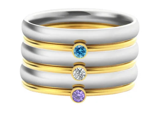 Gold geometric engraved titanium steel ring with a superimposed dark blue December birthstone.