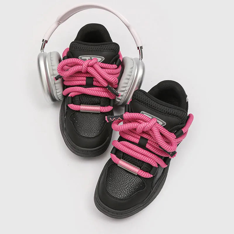A pair of solid-colour casual lace-up shoes with a thick rubber sole and round toe