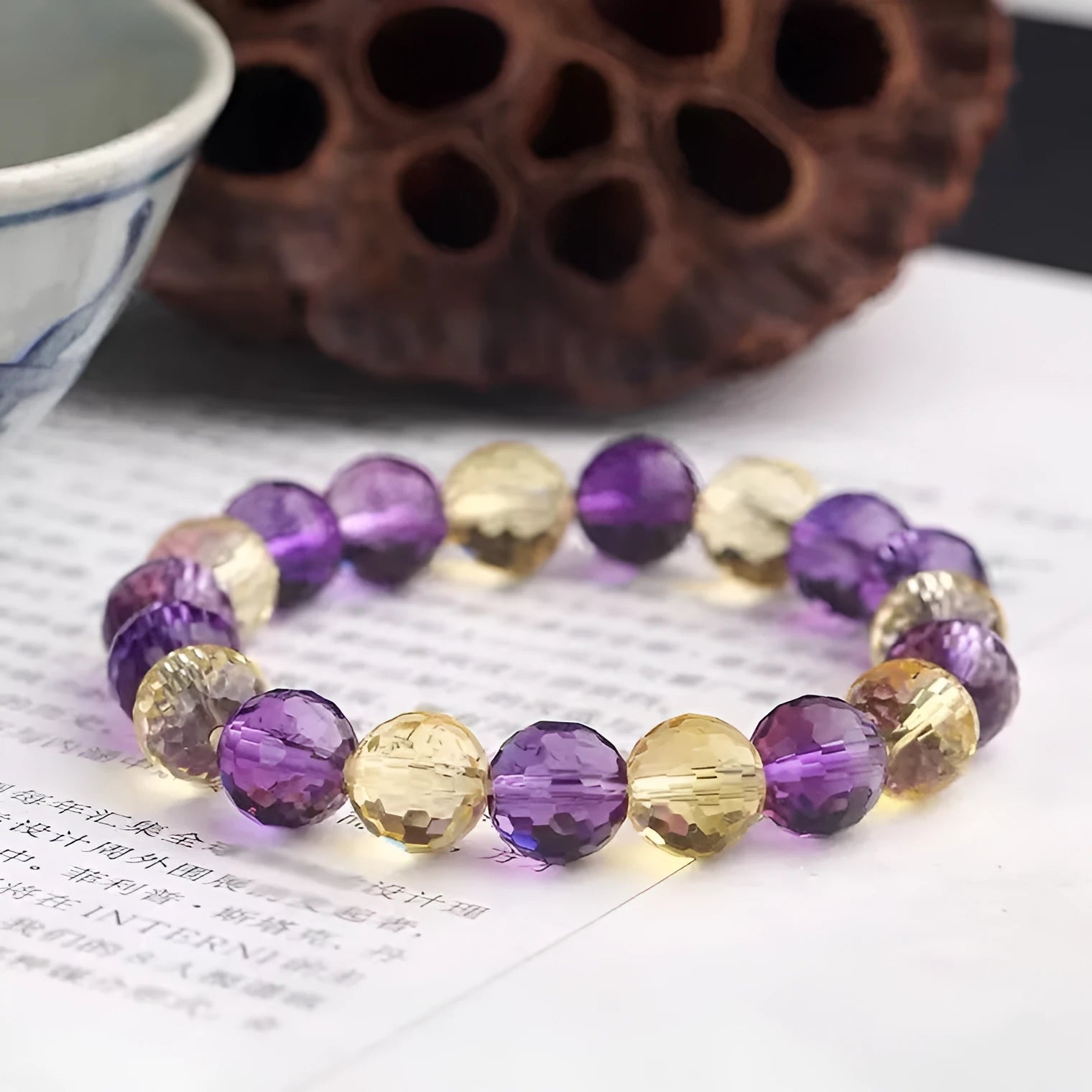 Handmade ametrine bracelet with detailed 128-cut crystal beads on wrist.