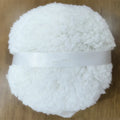 Oversized rectangular plush powder puff for makeup, shown in pink, white, and skin colour options.