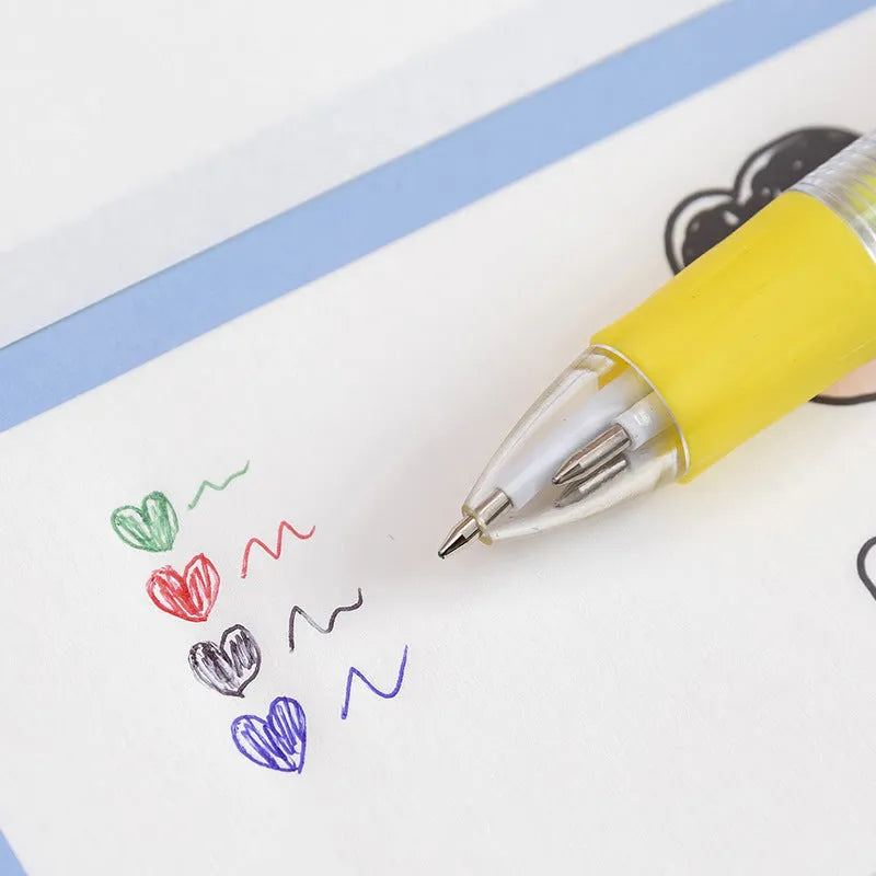 Cartoon-themed four-colour press ballpoint pen showing colour selection button and decorative designs