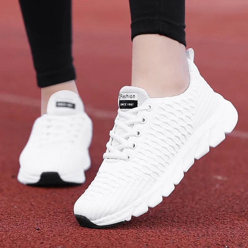 Women's black running shoes with a fly weave upper and wear-resistant outsole.