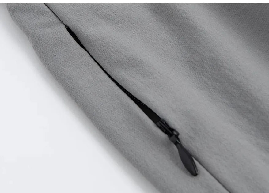 Loose cropped sports pants with printed waistband in grey, black, and blue colour options
