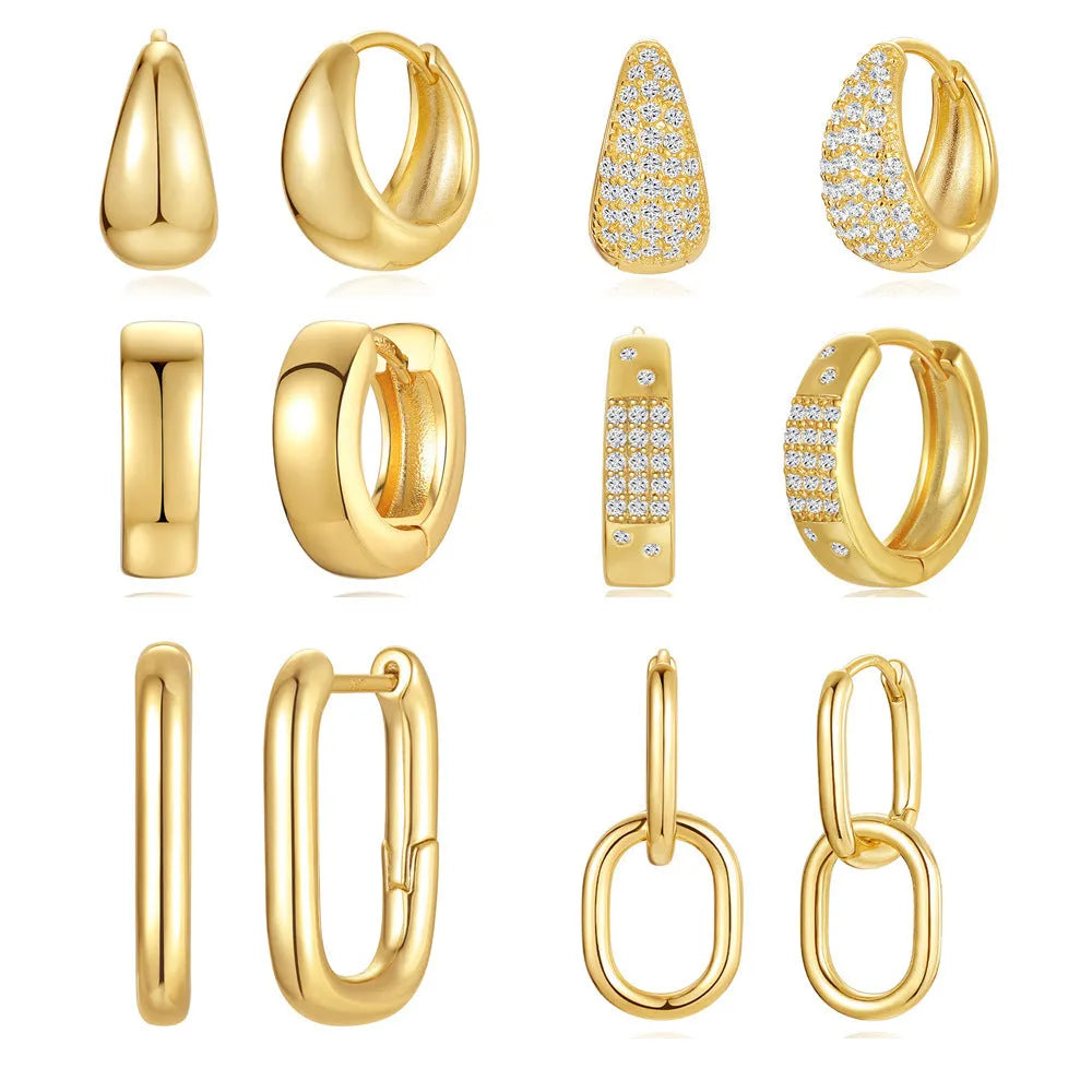 A pair of round, geometric brass earclip earrings with a gold electroplated finish.