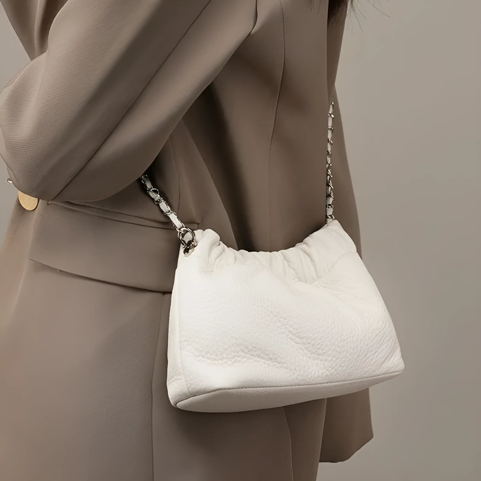 Women's genuine leather chain crossbody bag in soft dumpling shape with phone pocket, beige colour option