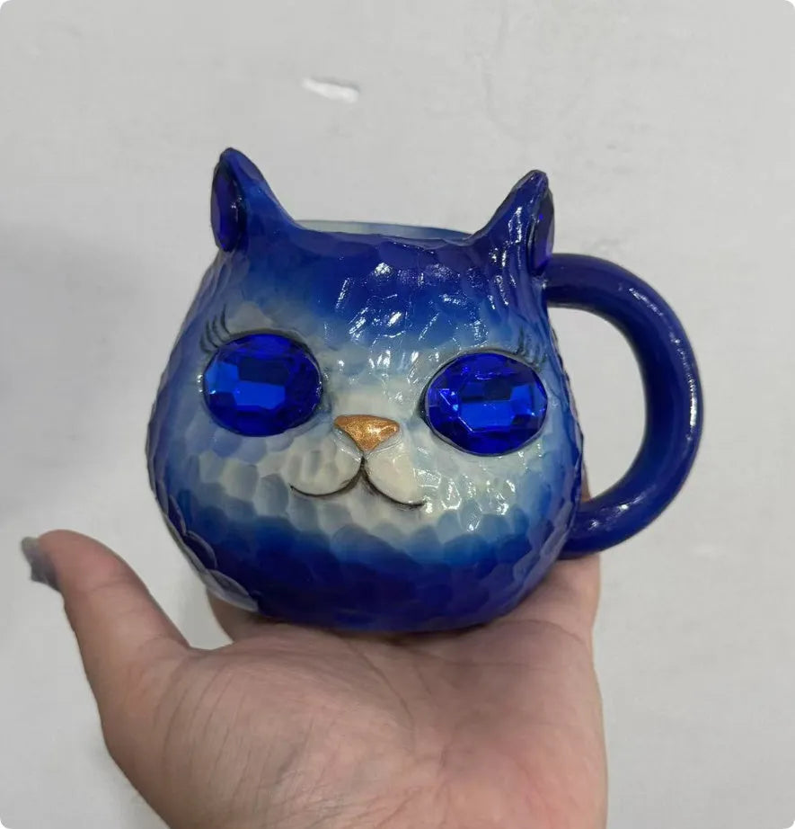 Handmade resin cat craft cup with hand-painted detailing in blue, green, pink, or purple.