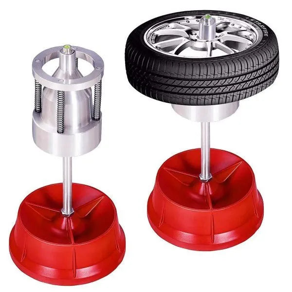 Portable manual hub balancer with aluminium head and bull's eye level on enamel base.