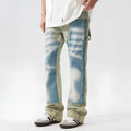 Retro dual-colour yellow and blue patchwork jeans with splash-ink damaged design, mid-waist cut