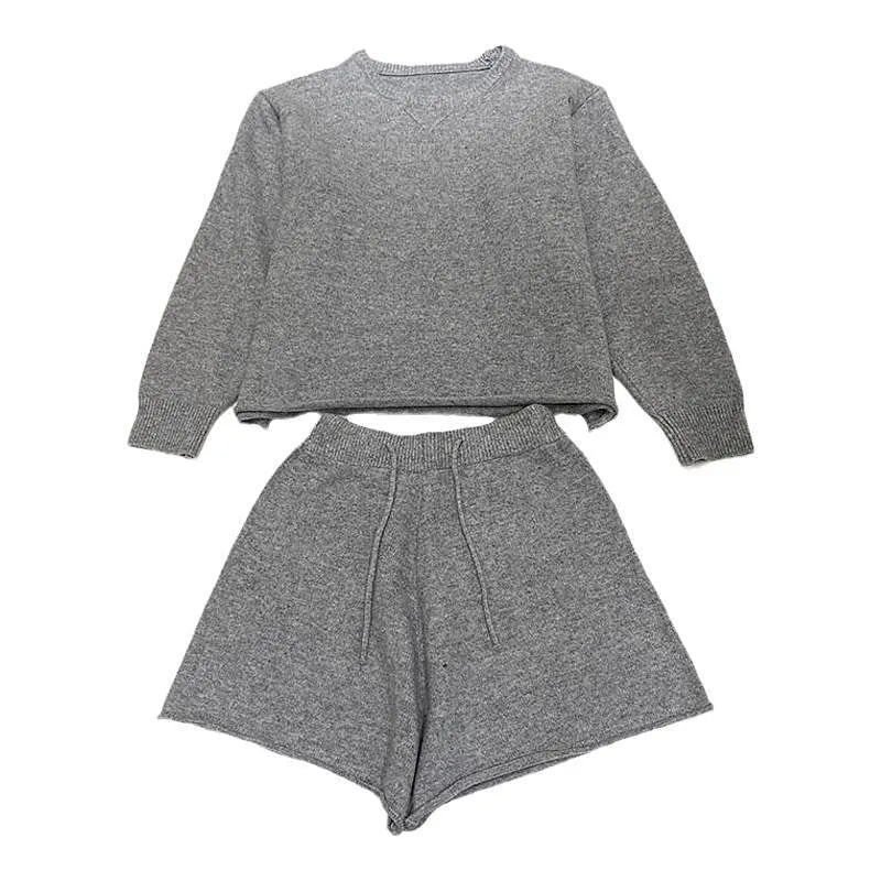 Women's loose-fitting long sleeve sweater and knitted wide-leg shorts co-ord set in dark grey.