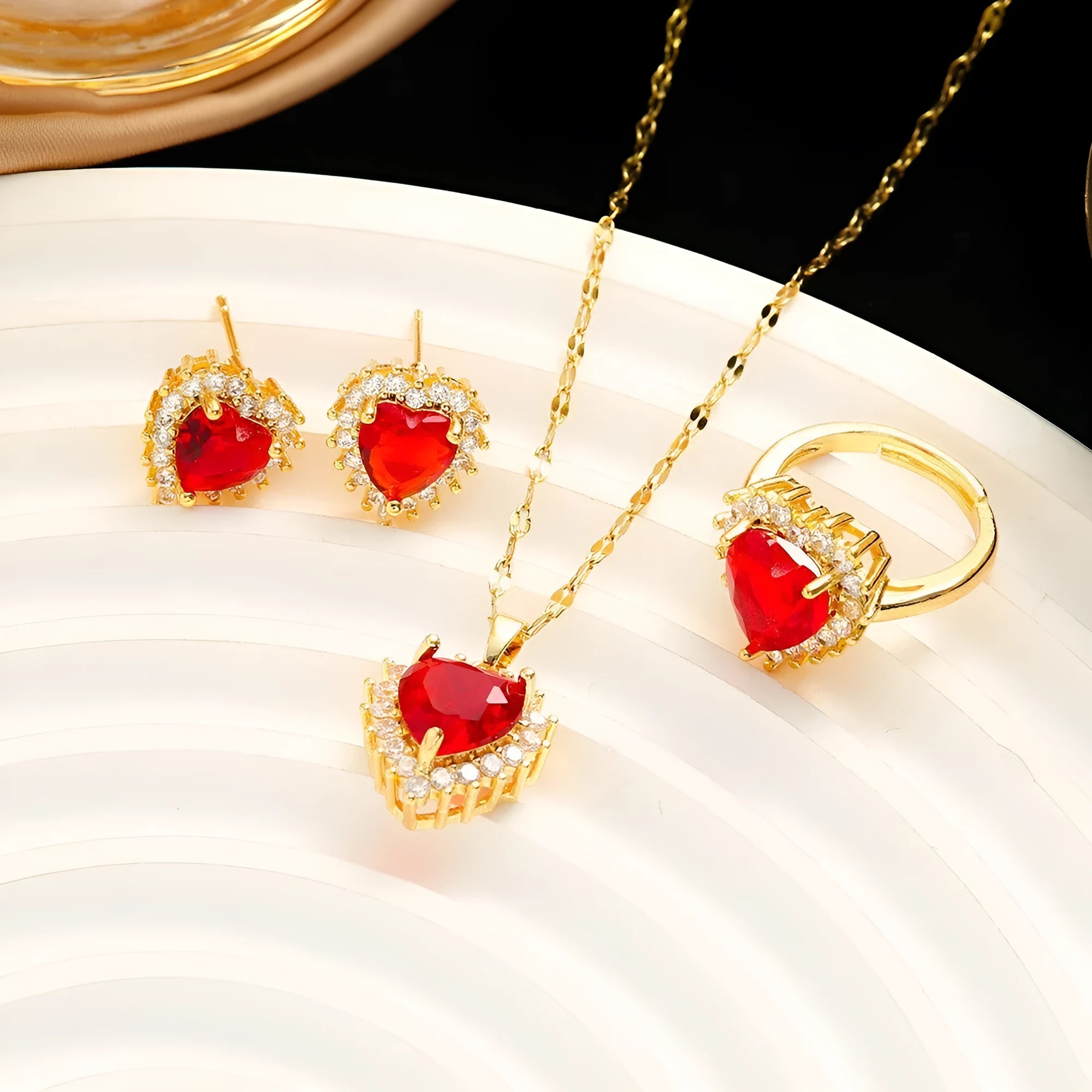 Red gold titanium steel heart flower necklace set with gem inlay pendant, matching ear studs, and ring on water wave chain