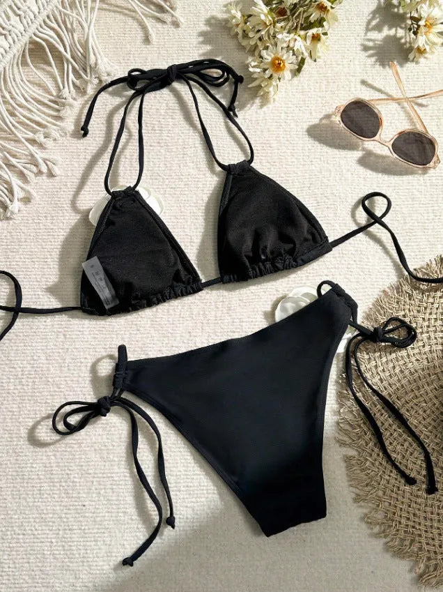Black 3D flower lace drawstring bikini swimsuit with backless top and shorts on a model