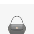Soft wing-shaped leather cross-body tote bag in cow leather with a buckle and latch closure.