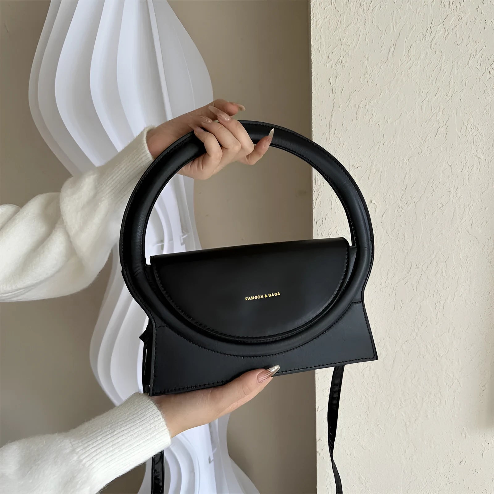 PU leather messenger bag in horizontal square shape with phone compartment and stitching detail