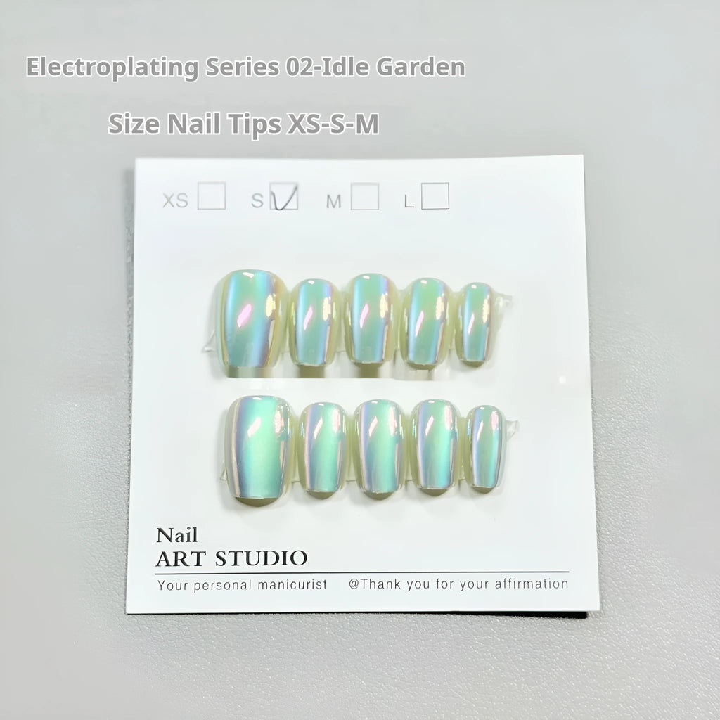Set of electroplated Cat's Eye false nails in short ladder sizes showing Aurora and solid colour designs.