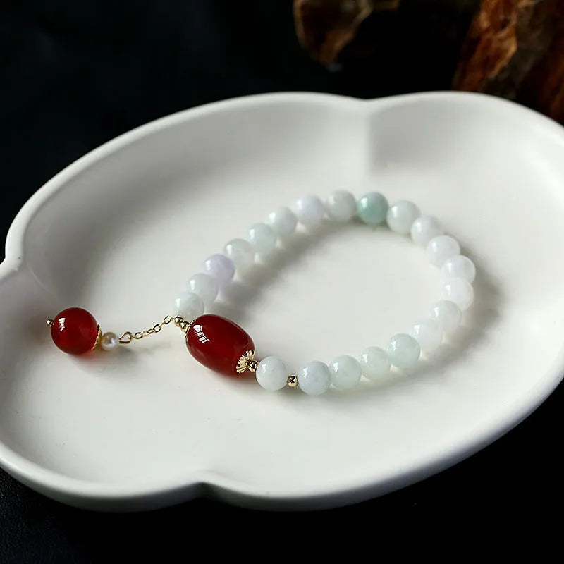 Women's bracelet with red agate round beads 7.5mm and hanging tassel in 14K gilded finish