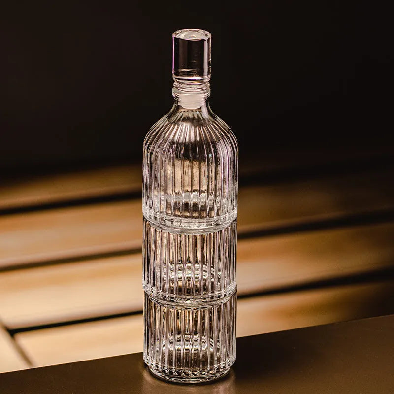 Clear glass cup and pot set with striped and diamond pattern designs for whiskey or wine