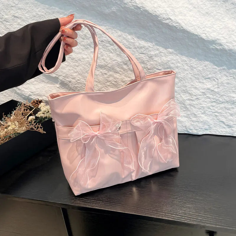 College style bow tote bag in black with large capacity, PU material, and double shoulder straps