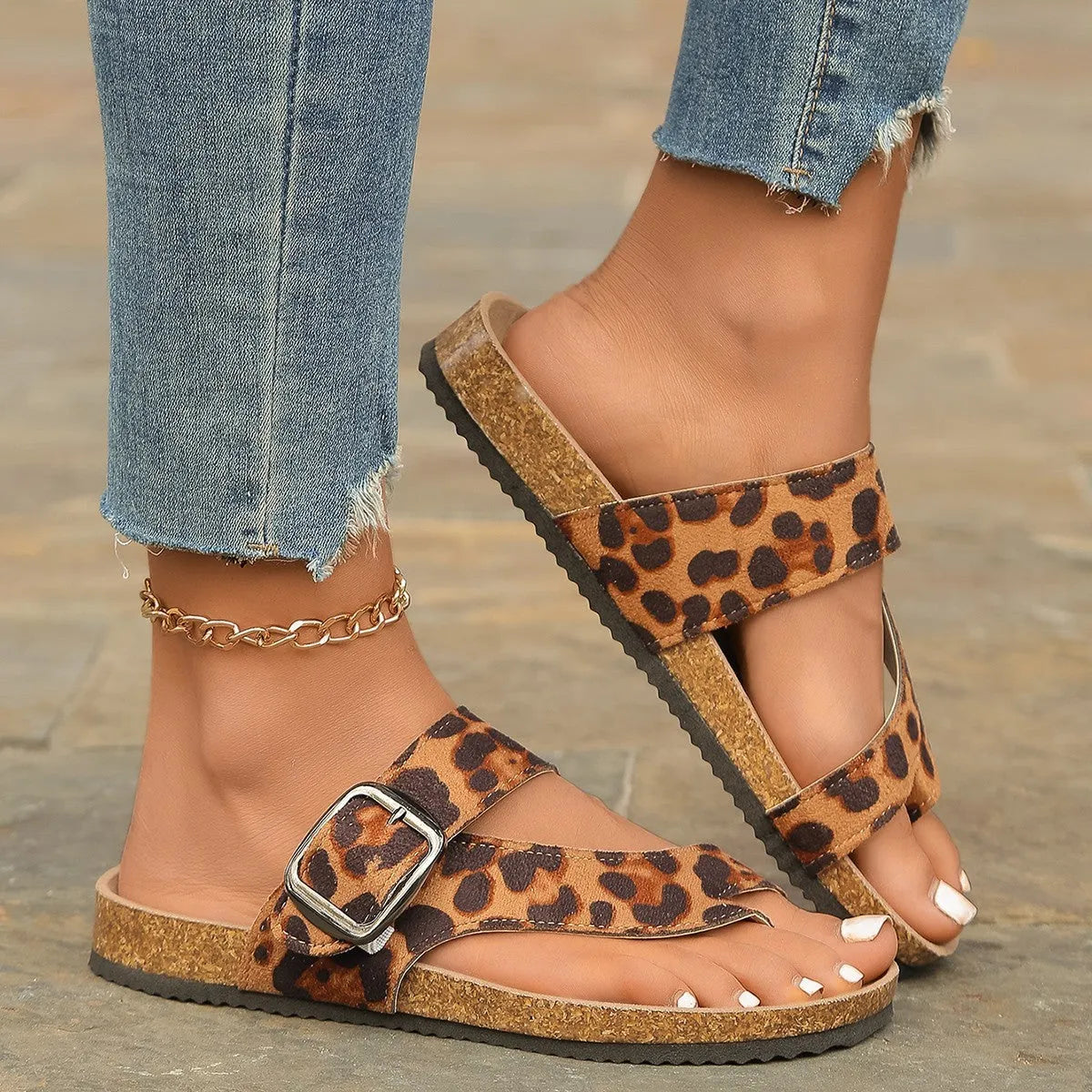 Roman style toe covering leopard slippers with wooden sole on neutral background