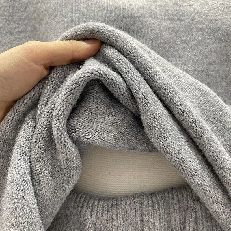 Women's loose-fitting long sleeve sweater and knitted wide-leg shorts co-ord set in dark grey.