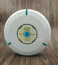 Black and white ABS robot vacuum cleaner on a wooden floor