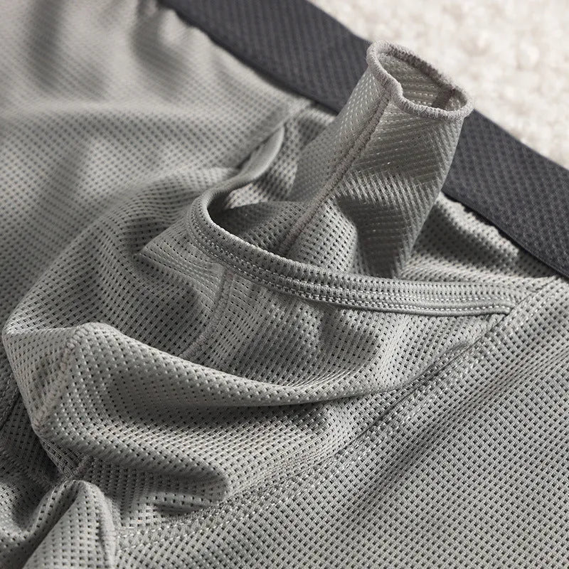 Men's ice silk boxer in black with mesh knit fabric, low waist, and solid colour design