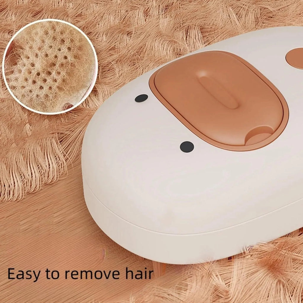 White rechargeable steam pet brush for dogs and cats on a table