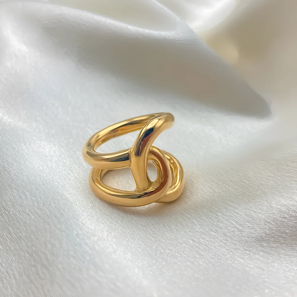 Women's stainless steel adjustable opening ring with knot design in gold or steel colour